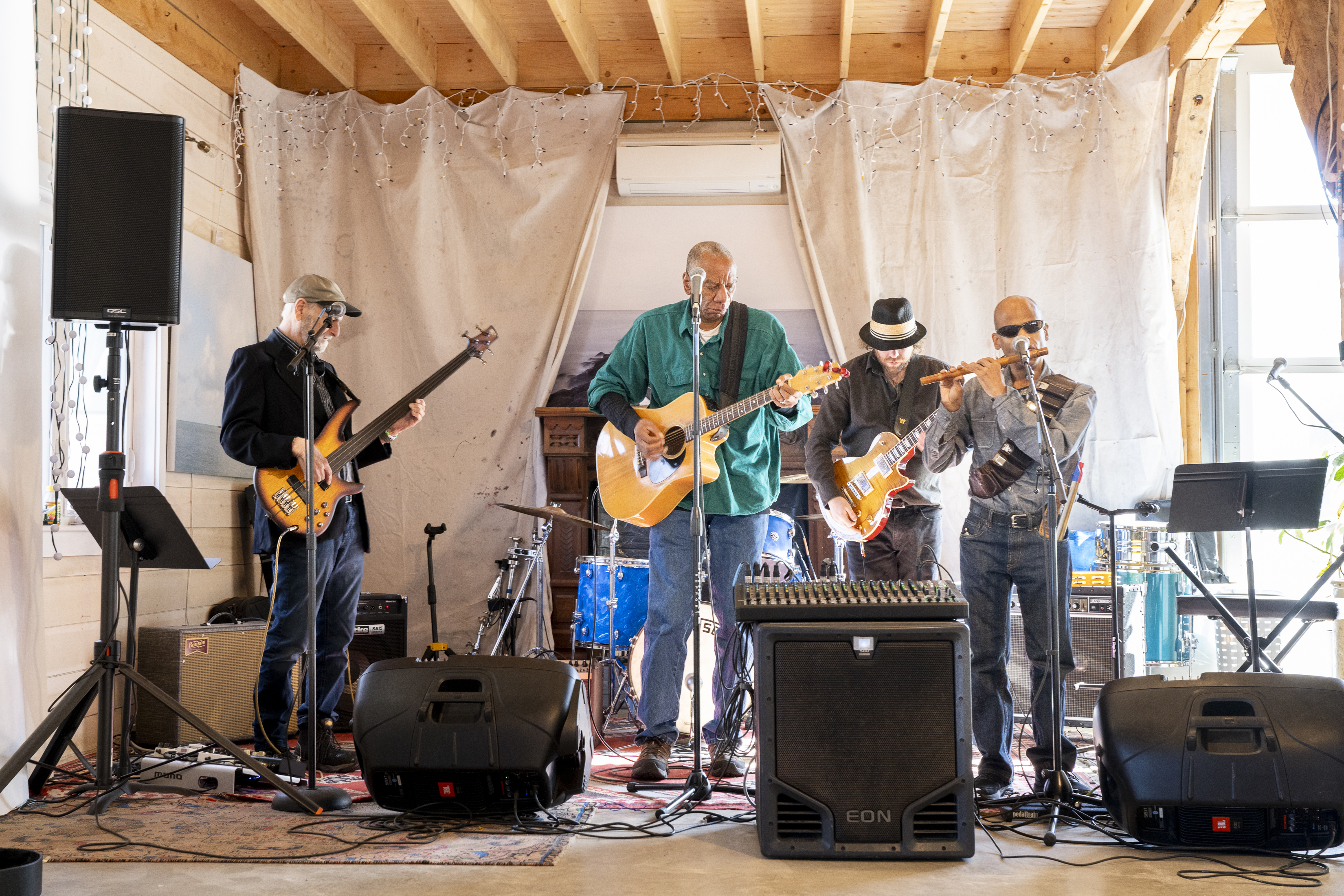 Four memebers of 13 Scotland Rd playing their instruments. 